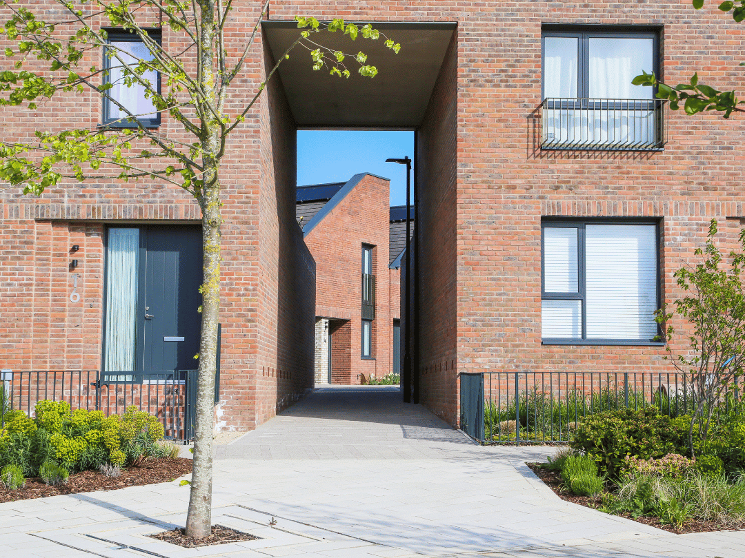 Peering through a large alley way on Fairlawn Avenue to reveal the beautiful tailfin roofs at Brabazon.