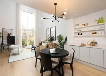 Open-plan kitchen diner, with the added benefits of a seating area and ample natural lighting.