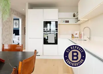 Modern kitchen and dining at The Dials with white cabinets and premium appliances.
