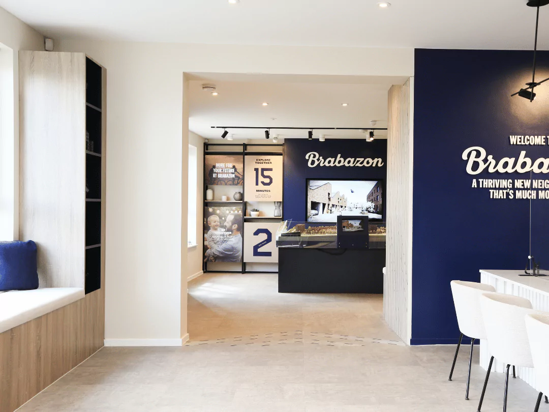 A wide angle shot featuring the discovery wall and Hangar District model at the Sales Centre in Brabazon.