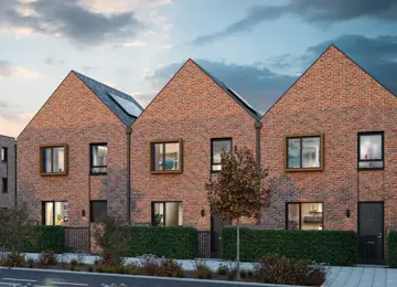Three red-brick Coanda homes with steep pitched roofs and a green hedgerow.