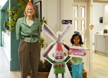 Woman dressed up as Norbot and young girl dressed up as a mermaid in celebration of Gromit Unleashed 3. 