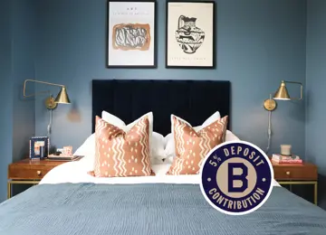 5% deposit contribution sticker overlaying blue primary bedroom, showcasing front facing shot of blue double bed. 