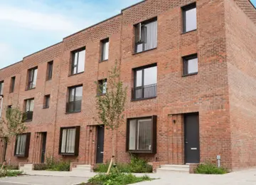 The front exterior of The Brandon red-brick townhouses at Brabazon.