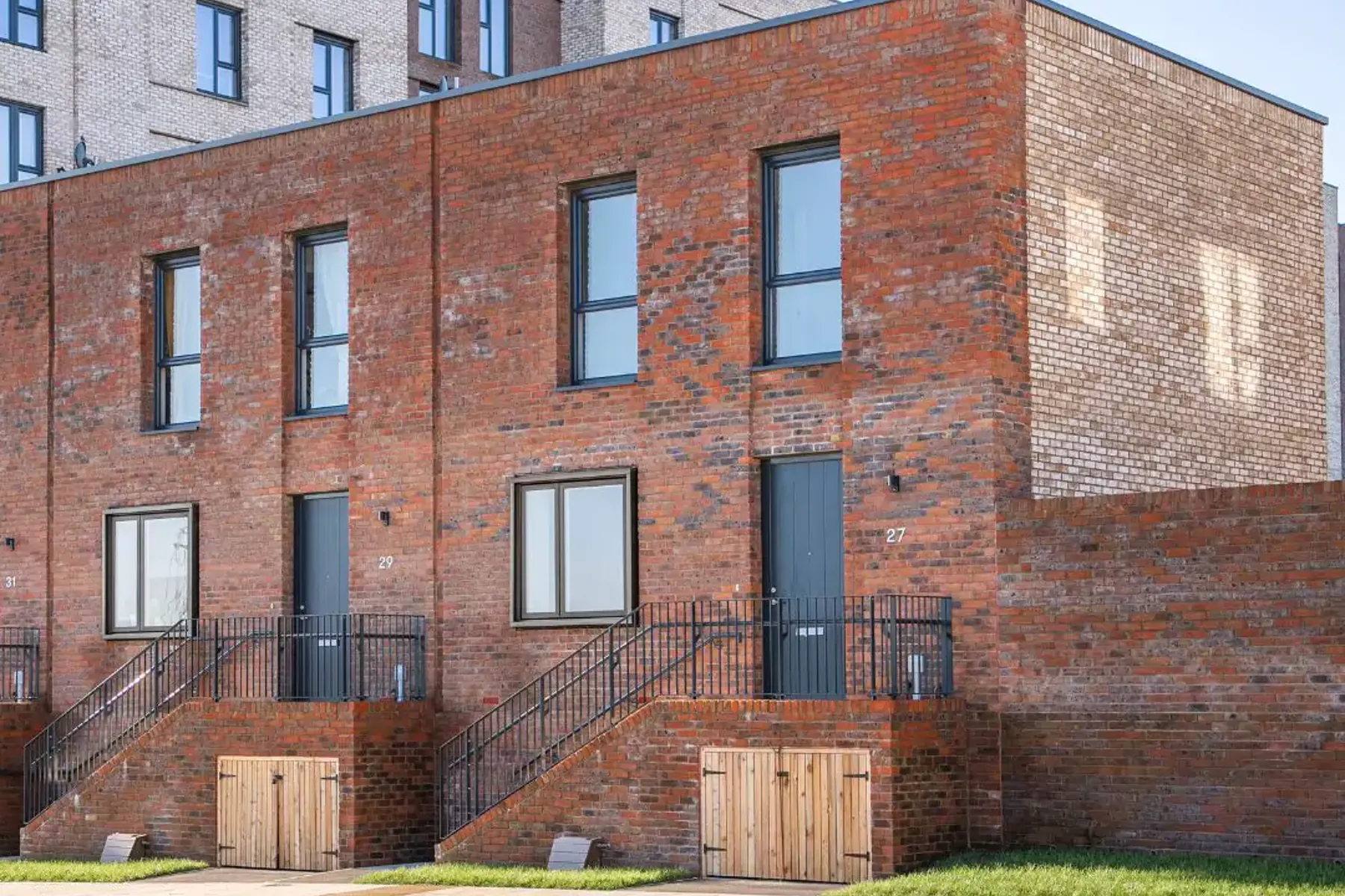 Front view of a modern, two-storey brick townhouse at Brabazon, Bristol.