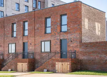 Front view of a modern, two-storey brick townhouse at Brabazon, Bristol.