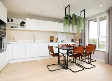 Open-plan kitchen diner, with the added benefit of a stylish seating area and plenty of natural light.