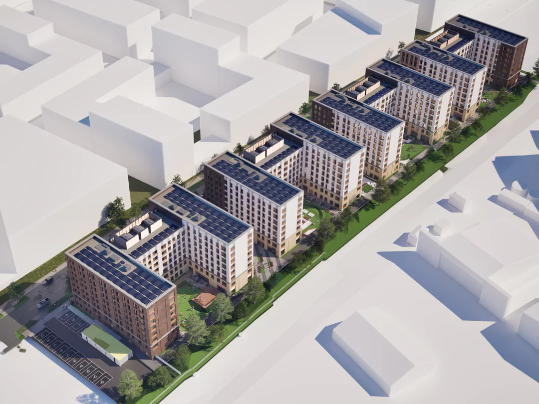 Aerial view of the planned student housing development featuring multiple interconnected buildings with solar panels on the rooftops and landscaped courtyards.