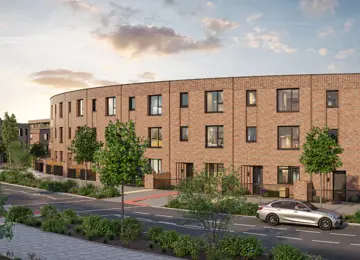 A row of three-storey Braemar townhomes on a curved tree-lined crescent at Brabazon.