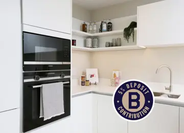 Cosy kitchen corner featuring styled shelving.